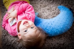 little-girl-laughing-at-the-carpet
